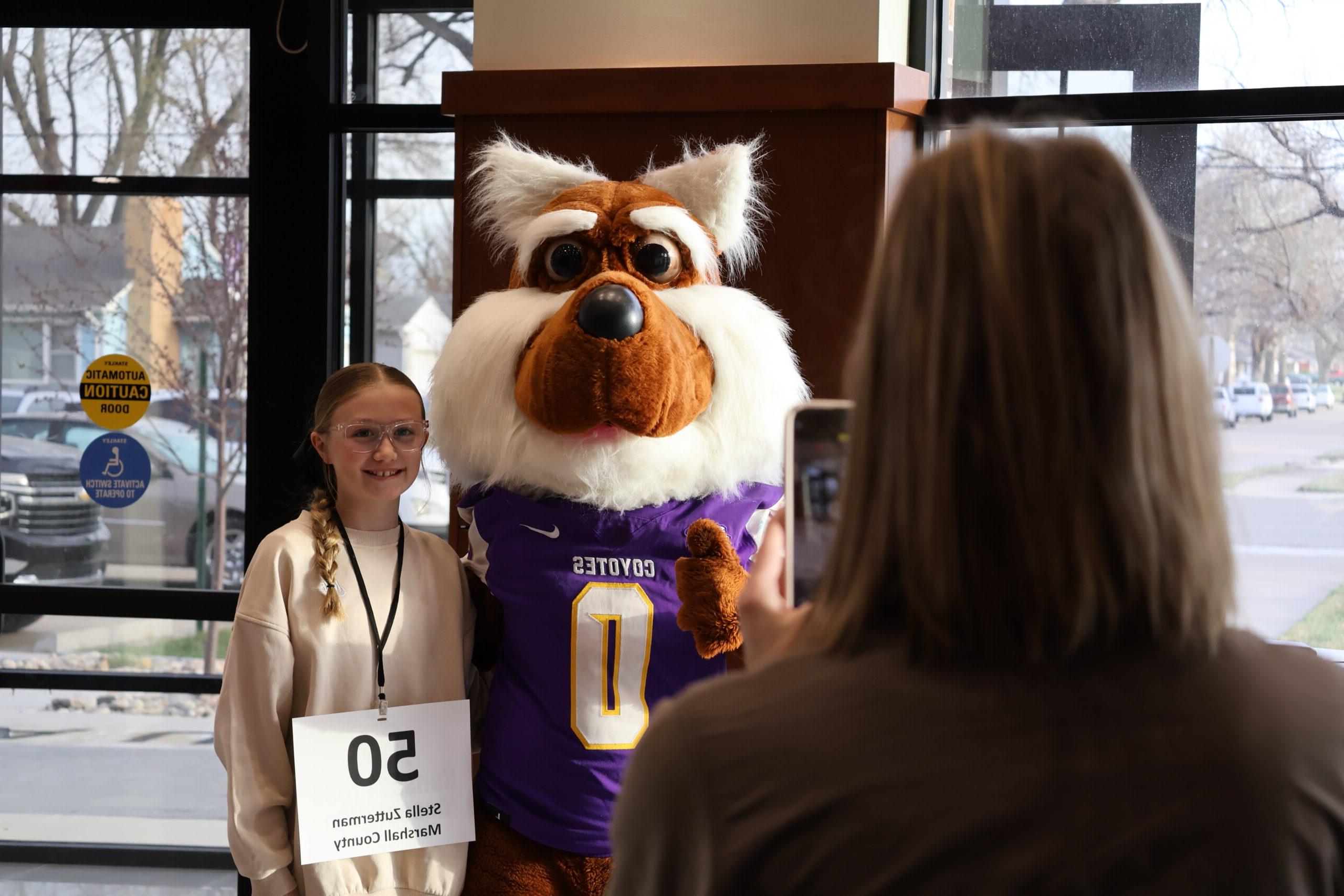 Female child with mascot